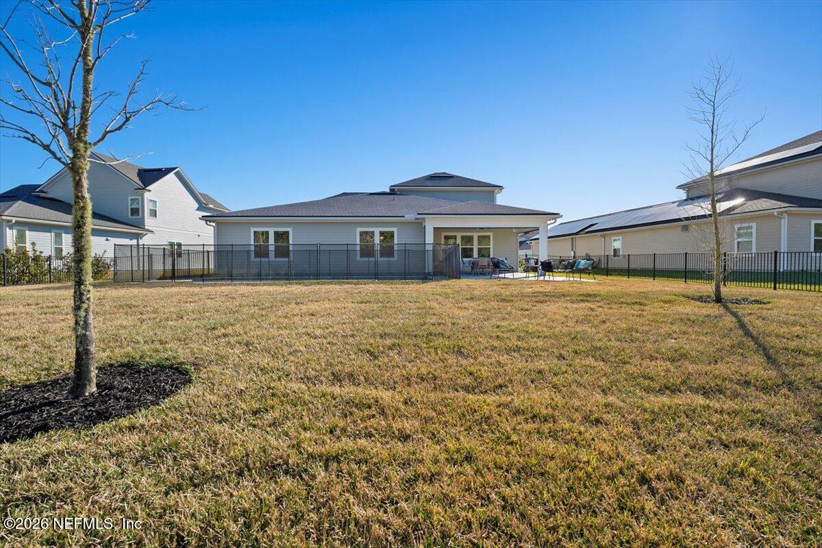 219 Morning Mist Lane St. Johns, FL 32259 - Photo 44 of 81 a front view of a house with a yard