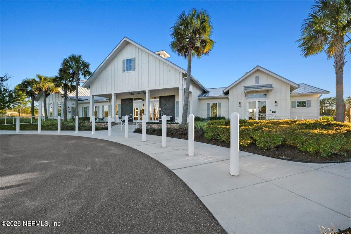 219 Morning Mist Lane St. Johns, FL 32259 - Photo 53 of 81 a front view of a house with a yard and potted plants
