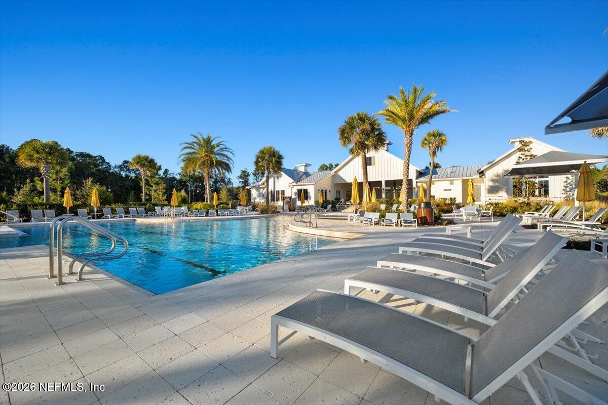 219 Morning Mist Lane St. Johns, FL 32259 - Photo 57 of 81 a view of a swimming pool with outdoor seating