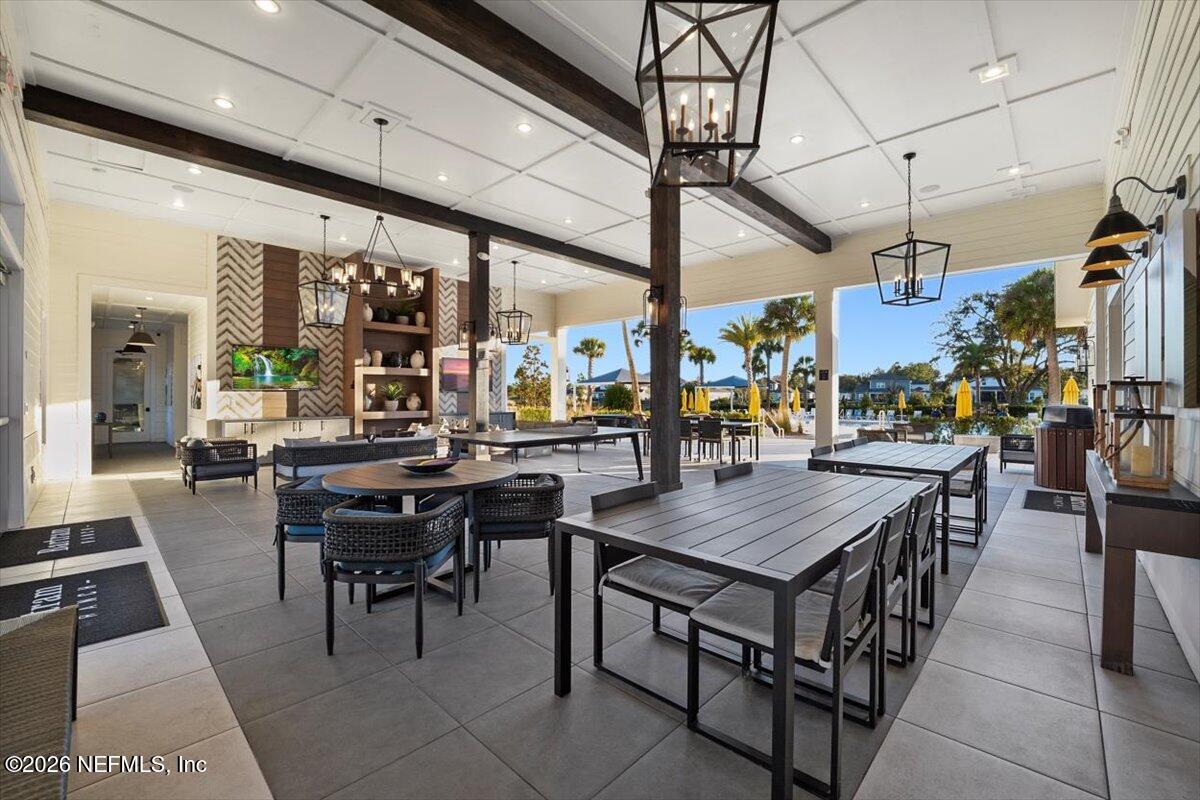 219 Morning Mist Lane St. Johns, FL 32259 - Photo 60 of 81 a view of a dining hall with many windows
