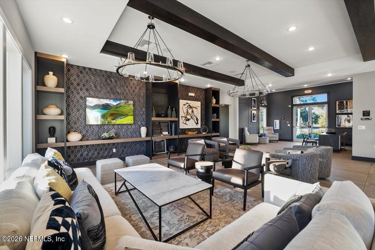 219 Morning Mist Lane St. Johns, FL 32259 - Photo 64 of 81 a living room with lots of furniture and a chandelier