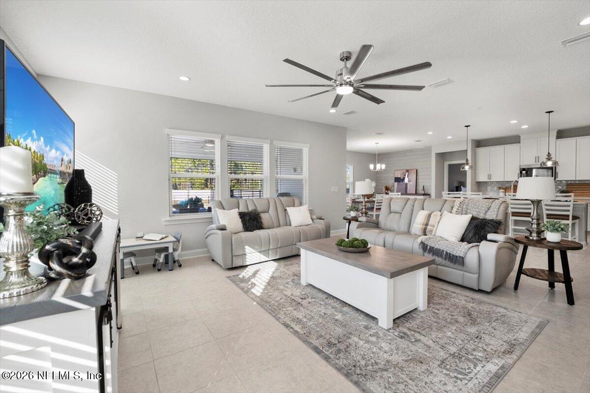 219 Morning Mist Lane St. Johns, FL 32259 - Photo 7 of 81 a living room with furniture and a large window