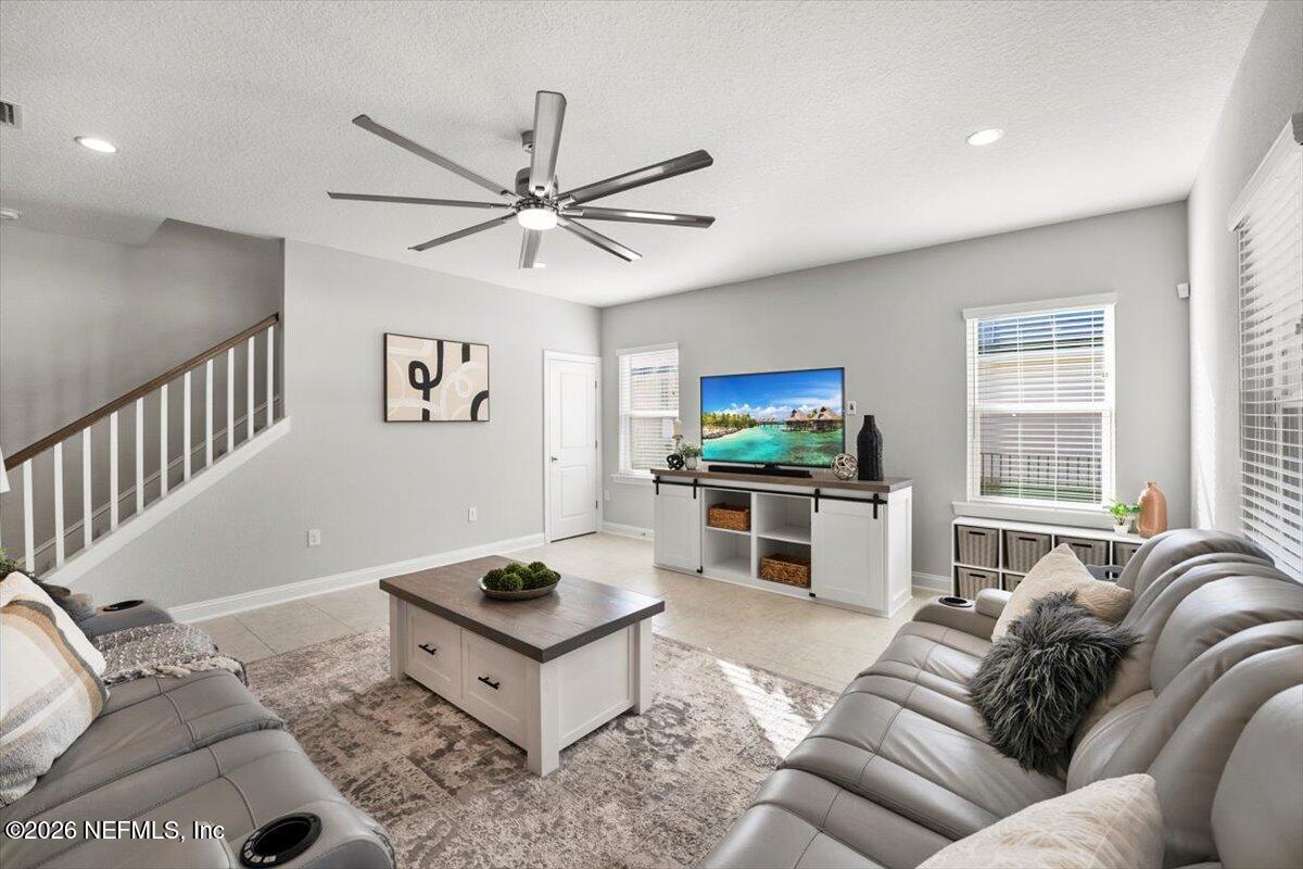 219 Morning Mist Lane St. Johns, FL 32259 - Photo 8 of 81 a living room with furniture and a flat screen tv