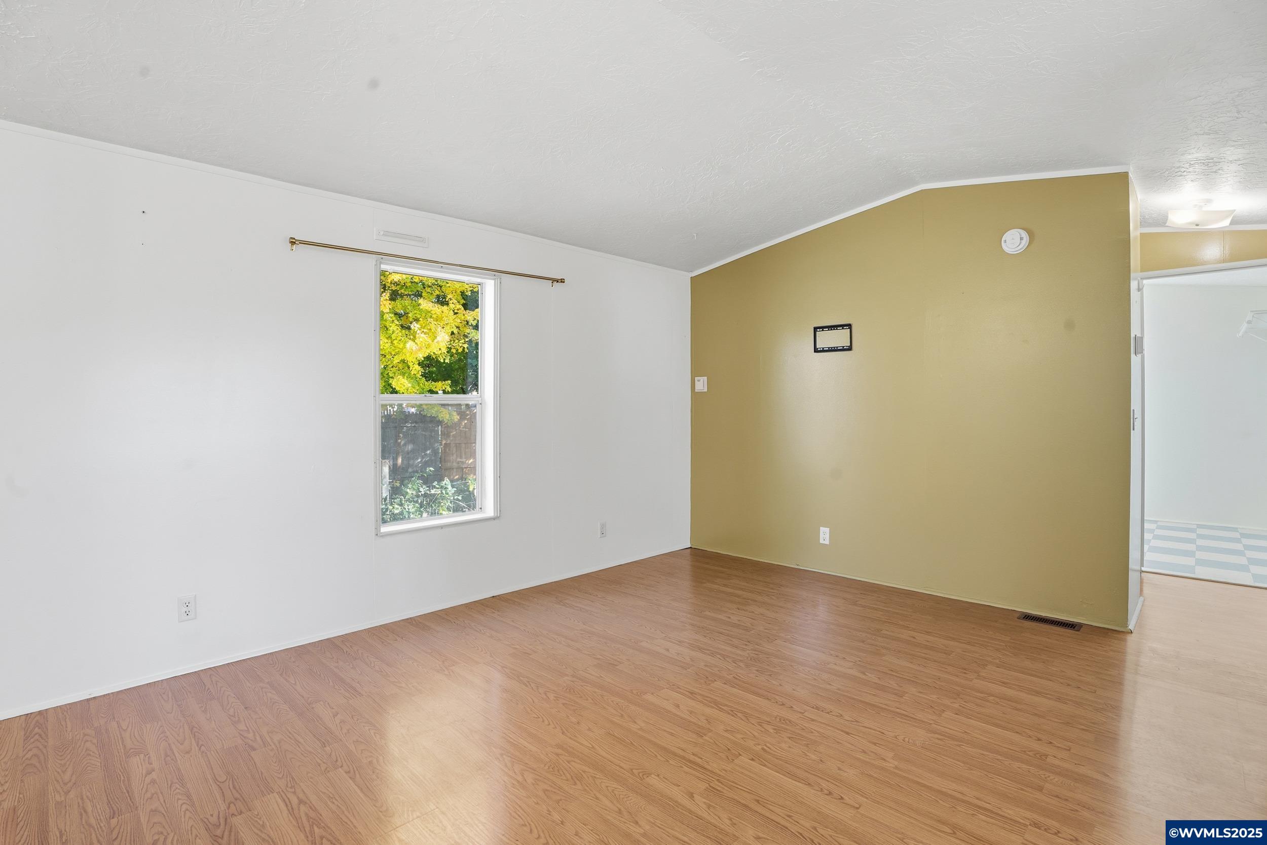 277 Edwards Road, Unit 145 Monmouth, OR 97361 - Photo 20 of 47 wooden floor in an empty room with a window
