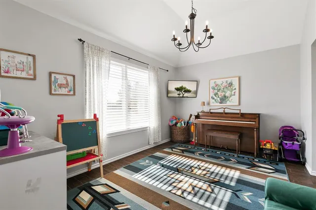 a bedroom with furniture and a window