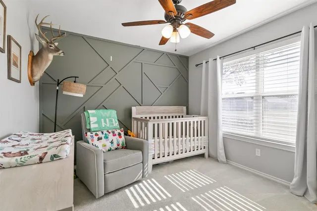 a bedroom with furniture and a window