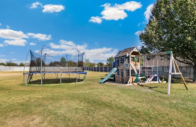 a view of a swimming pool with a chair and tables
