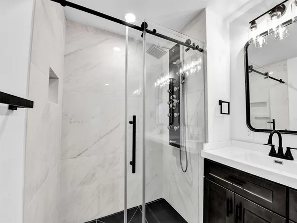 a bathroom with a sink and a mirror