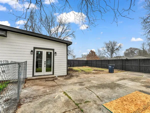 a view of a backyard of the house