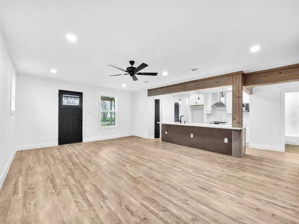 a bedroom with a bed and a large mirror