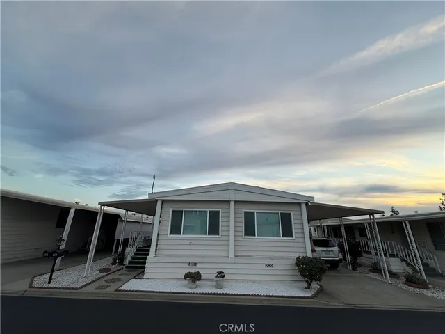 a view of house with backyard space