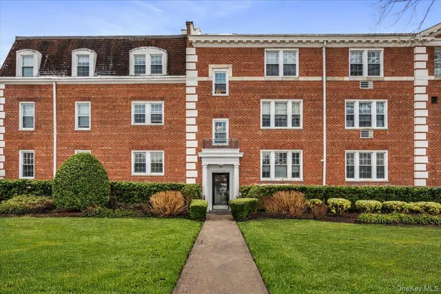 a front view of a building and yard