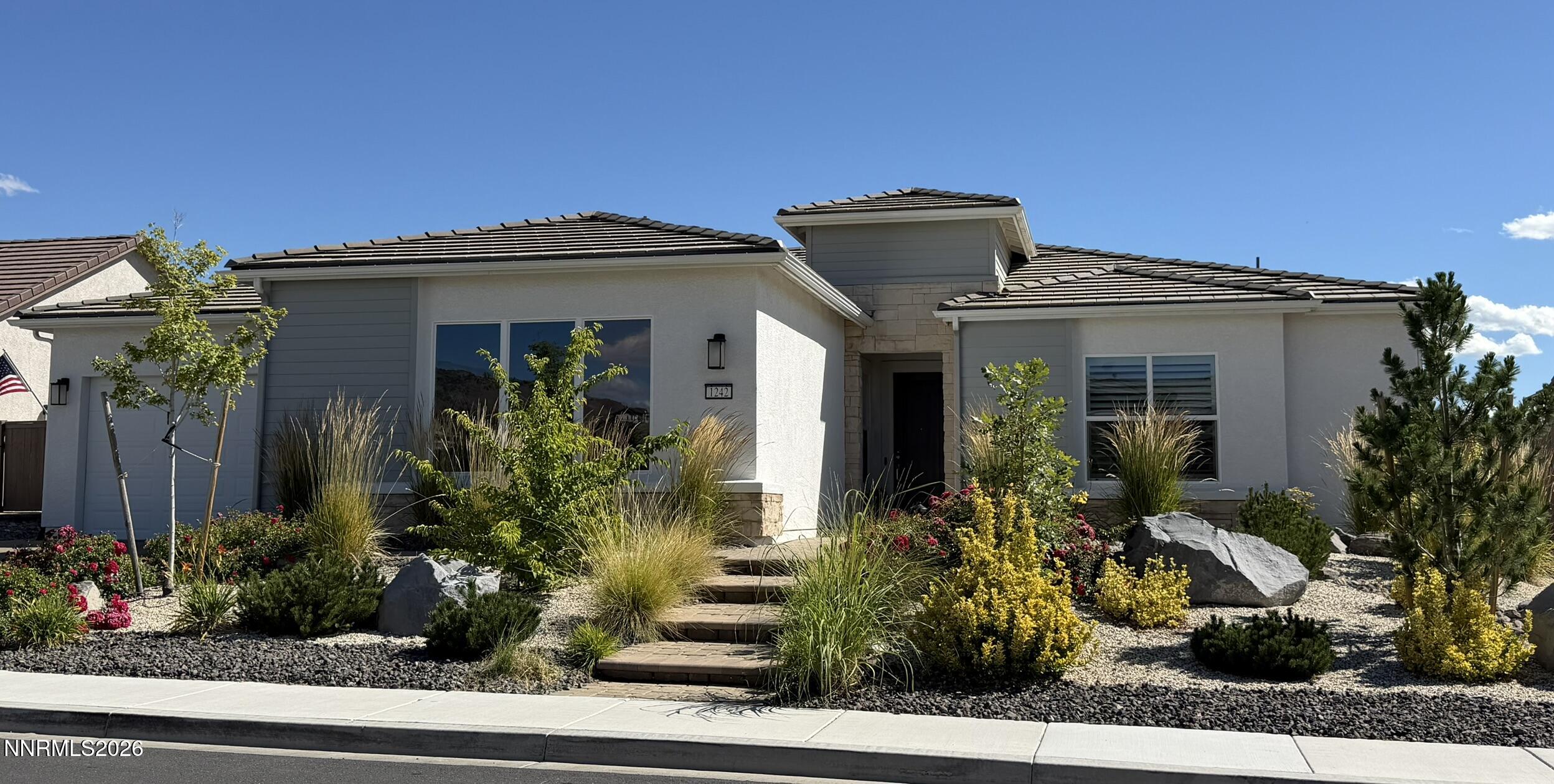1242 Crawford Crk Drive Reno, NV 89521 - Photo 1 of 1 a front view of a house with garden