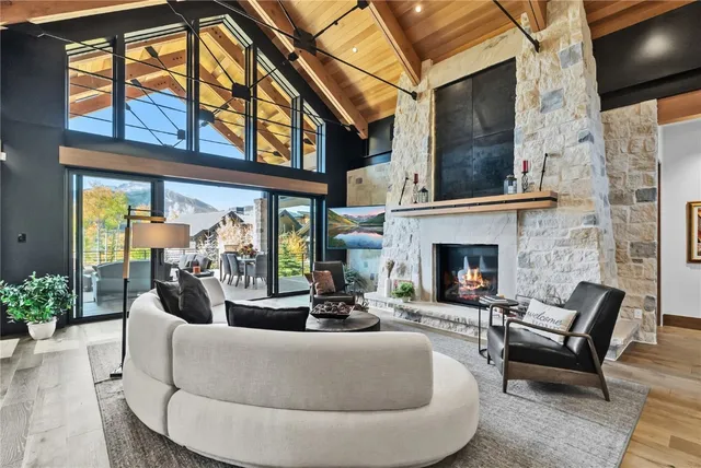 a living room with fireplace furniture and a flat screen tv