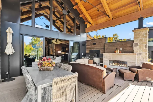 a outdoor living space with furniture and a fireplace
