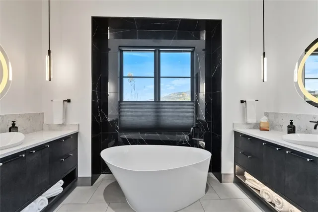 a bathroom with a bathtub and a sink