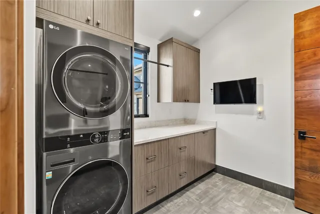 a view of a kitchen with washer and dryer