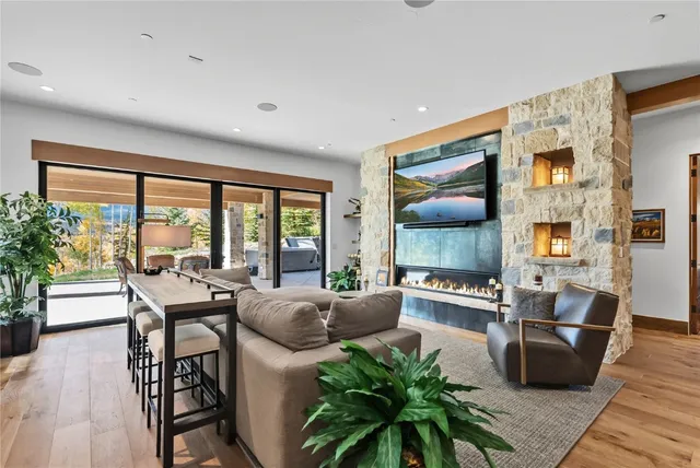 a living room with furniture and large windows