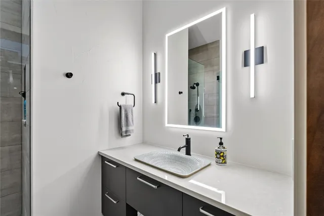 a bathroom with a sink and a mirror