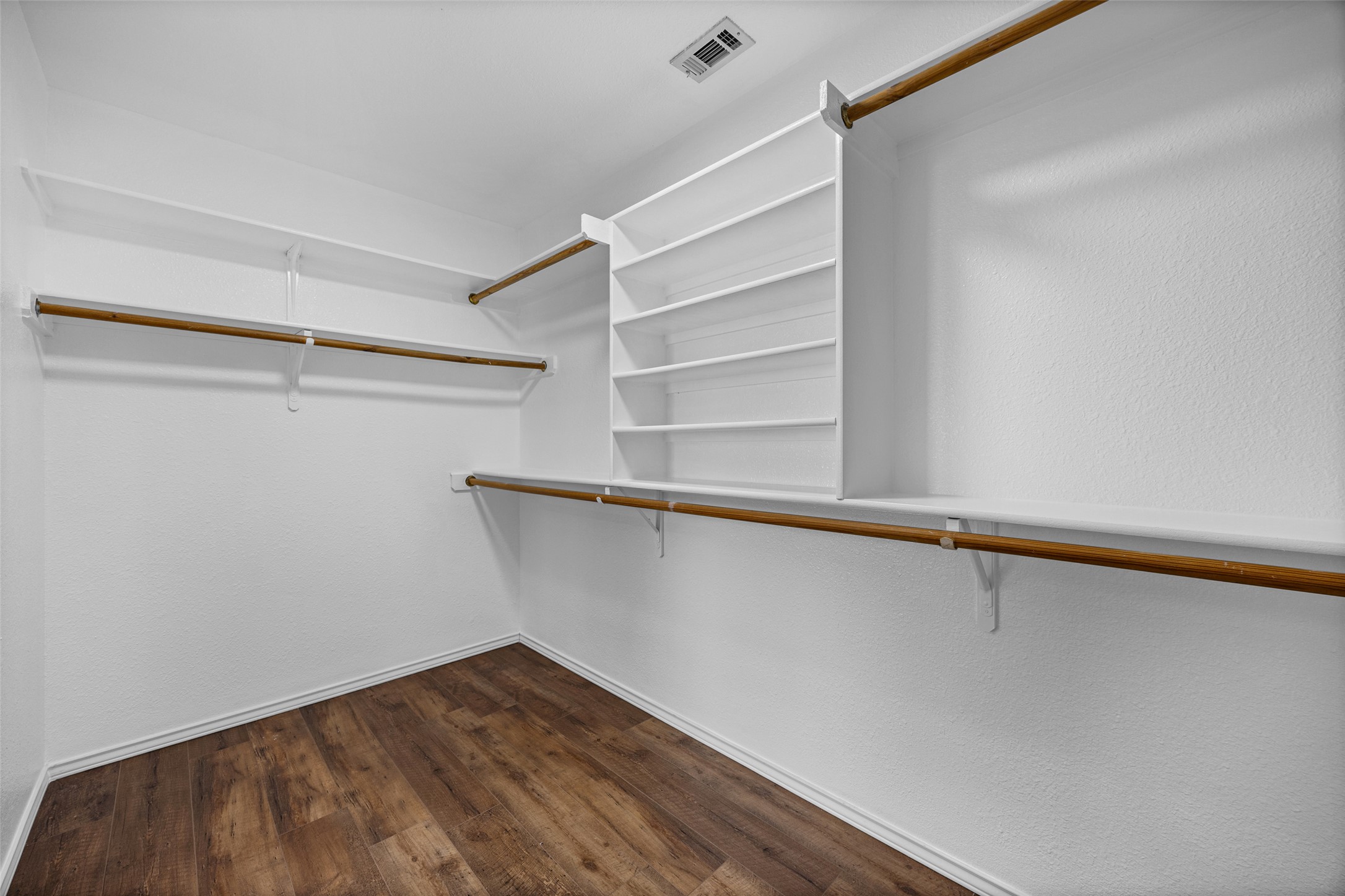 1524 Lochaline Loop Pflugerville, TX 78660 - Photo 15 of 22 Ample shelving and hanging space in this well-organized walk-in closet.