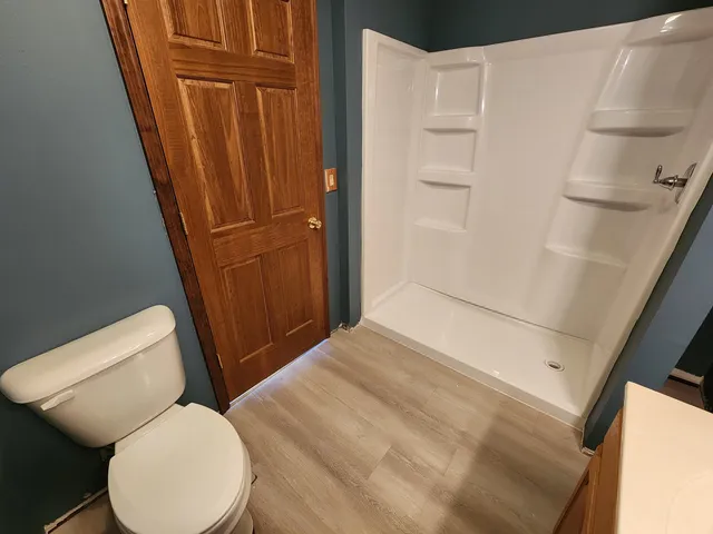 a bathroom with a toilet and tub