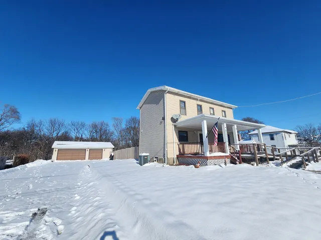 a terrace of a house with table and chairs