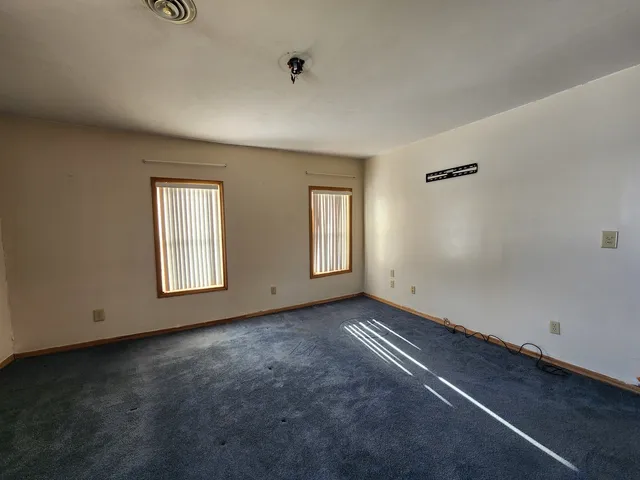 an empty room with windows