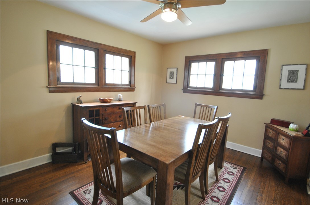 437 Malvern Road Akron, OH 44303 - Photo 5 of 19 Dining room has natural wood trim & wood floors, archways & ceiling fan/light fixture.