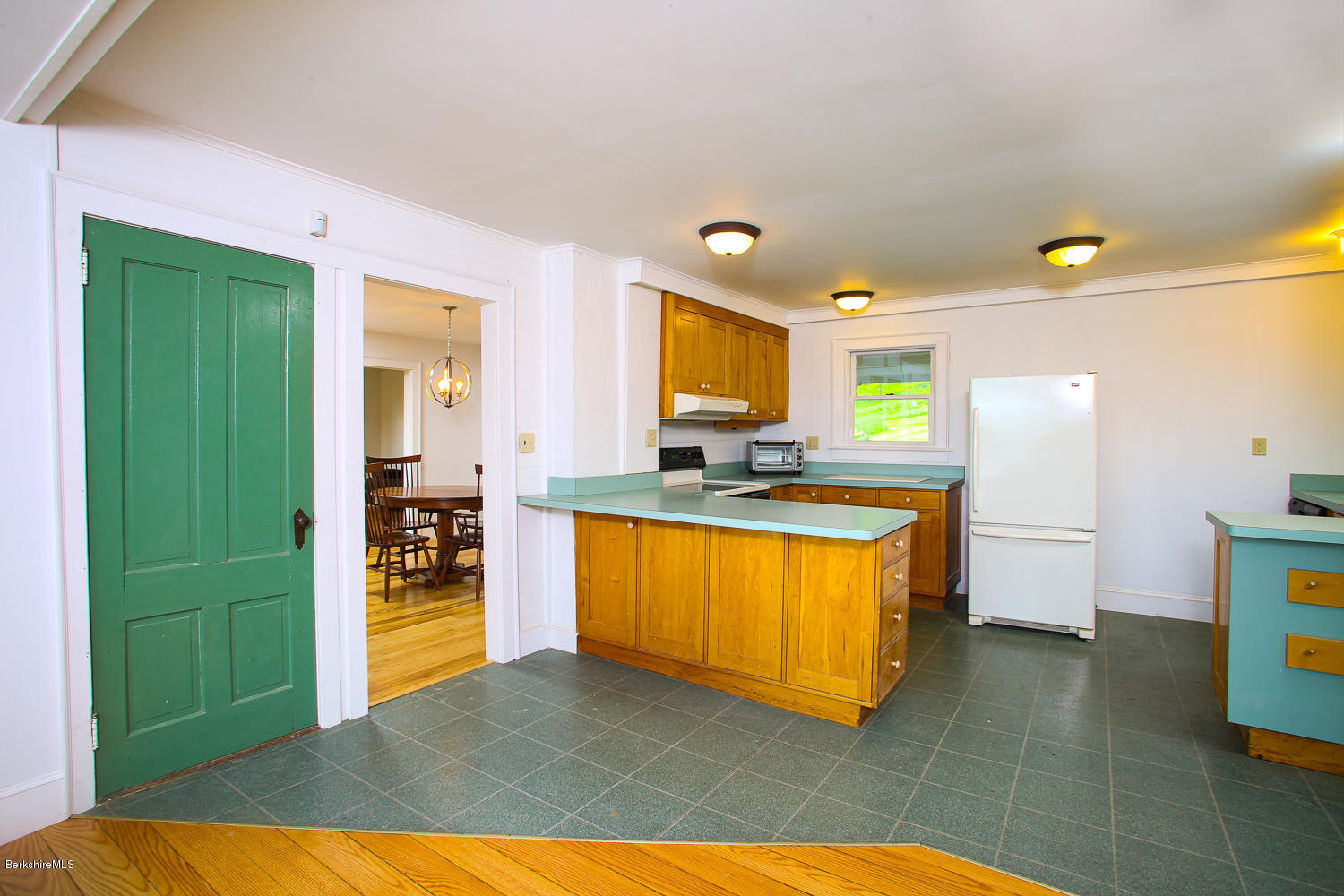837 Murray Road Ashfield, MA 01330 - Photo 9 of 37 a kitchen with stainless steel appliances kitchen island granite countertop a refrigerator and a sink