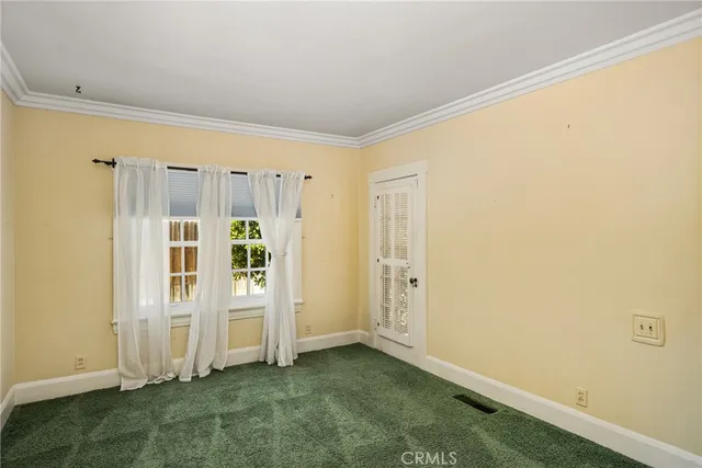 a view of a house with a large window