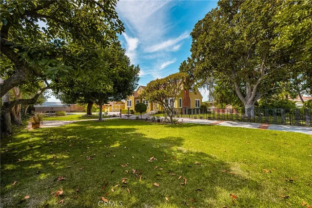 a view of swimming pool with trees and green space