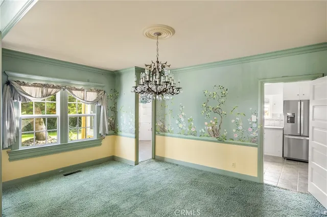 a view of a living room with chandelier