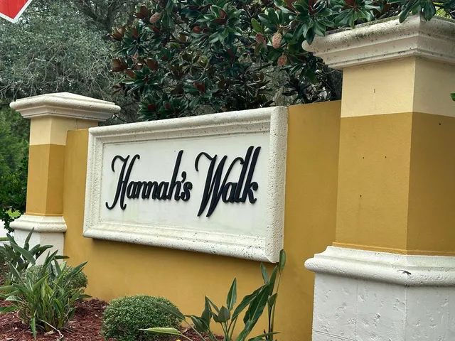 a white sign that is on the side of a building