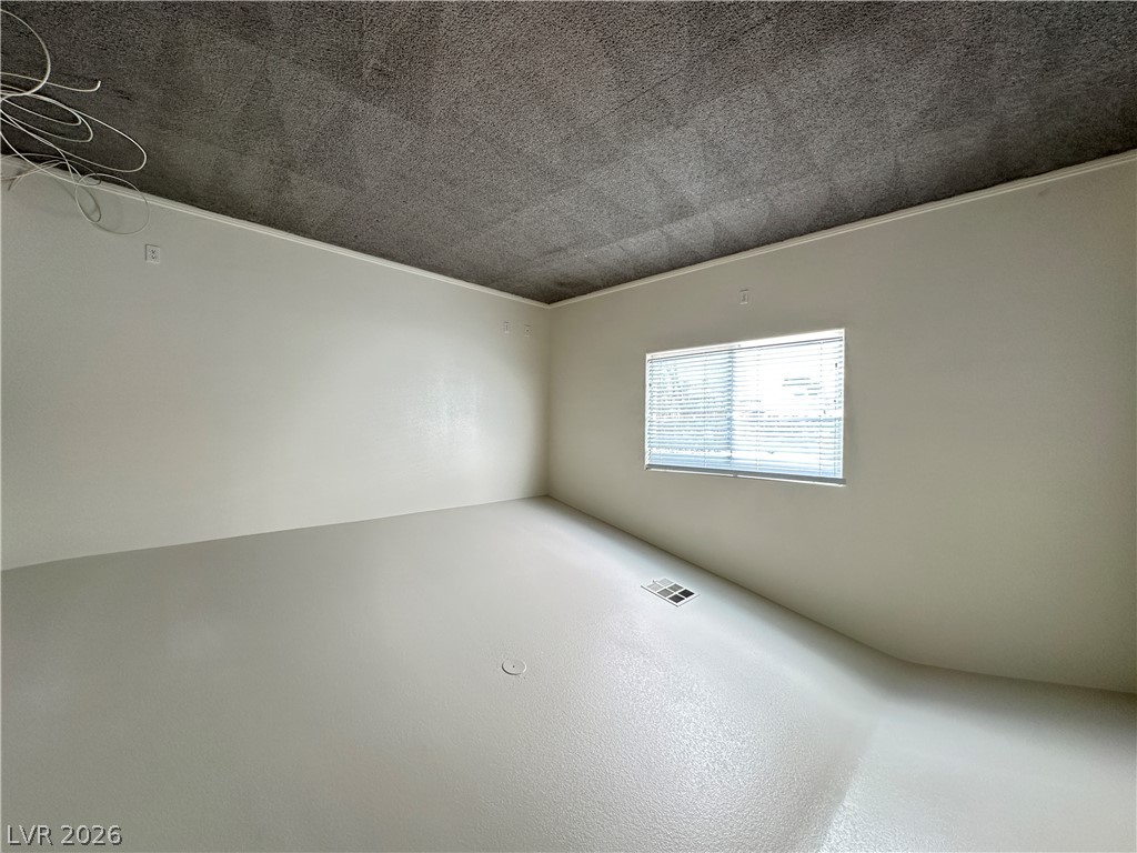 7305 Prussian Green Street Las Vegas, NV 89139 - Photo 14 of 23 Well-lit room with fresh flooring and a window offering natural light.