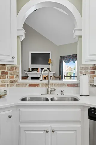 a living room with furniture and a mirror