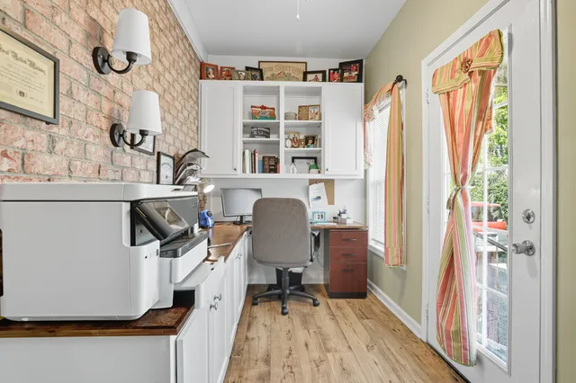 a living room with furniture a window and a chandelier