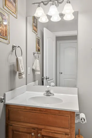 a bathroom with a sink a mirror and a shower