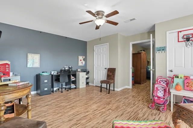 a view of a house with swimming pool and sitting area