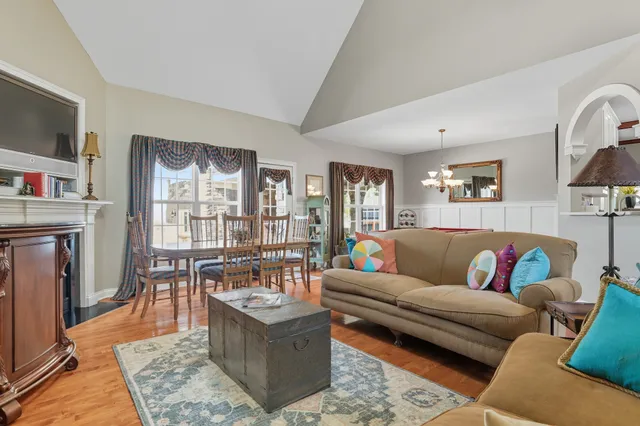 a room with pool table and windows