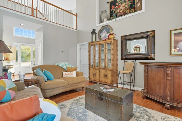 a kitchen with white cabinets and sink