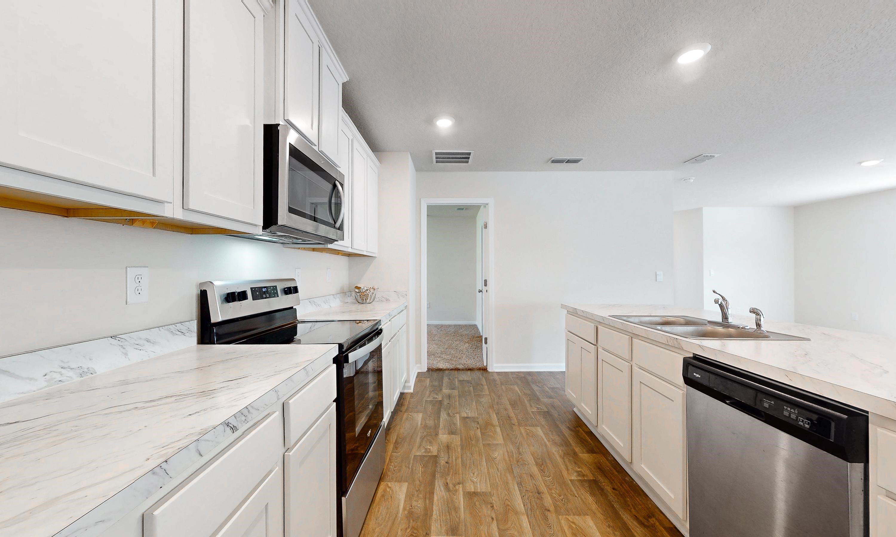 233 Falcon Ridge Road St. Augustine, FL 32084 - Photo 12 of 41 a kitchen with stainless steel appliances granite countertop a stove and a sink