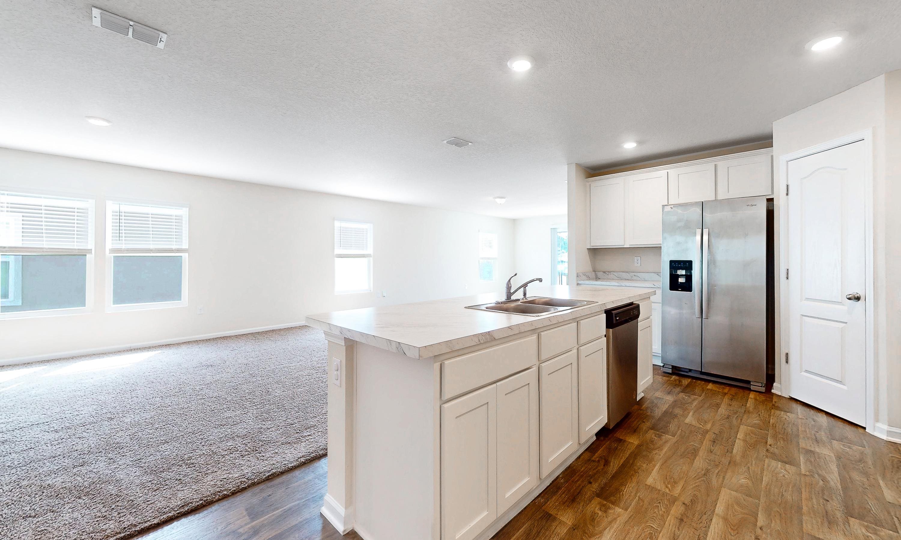 233 Falcon Ridge Road St. Augustine, FL 32084 - Photo 14 of 41 a kitchen with a sink a counter top space stainless steel appliances and cabinets