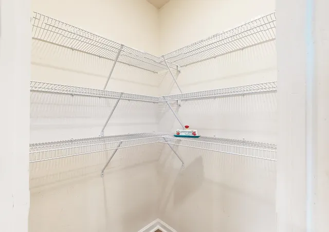a white bath tub sitting next to a shower