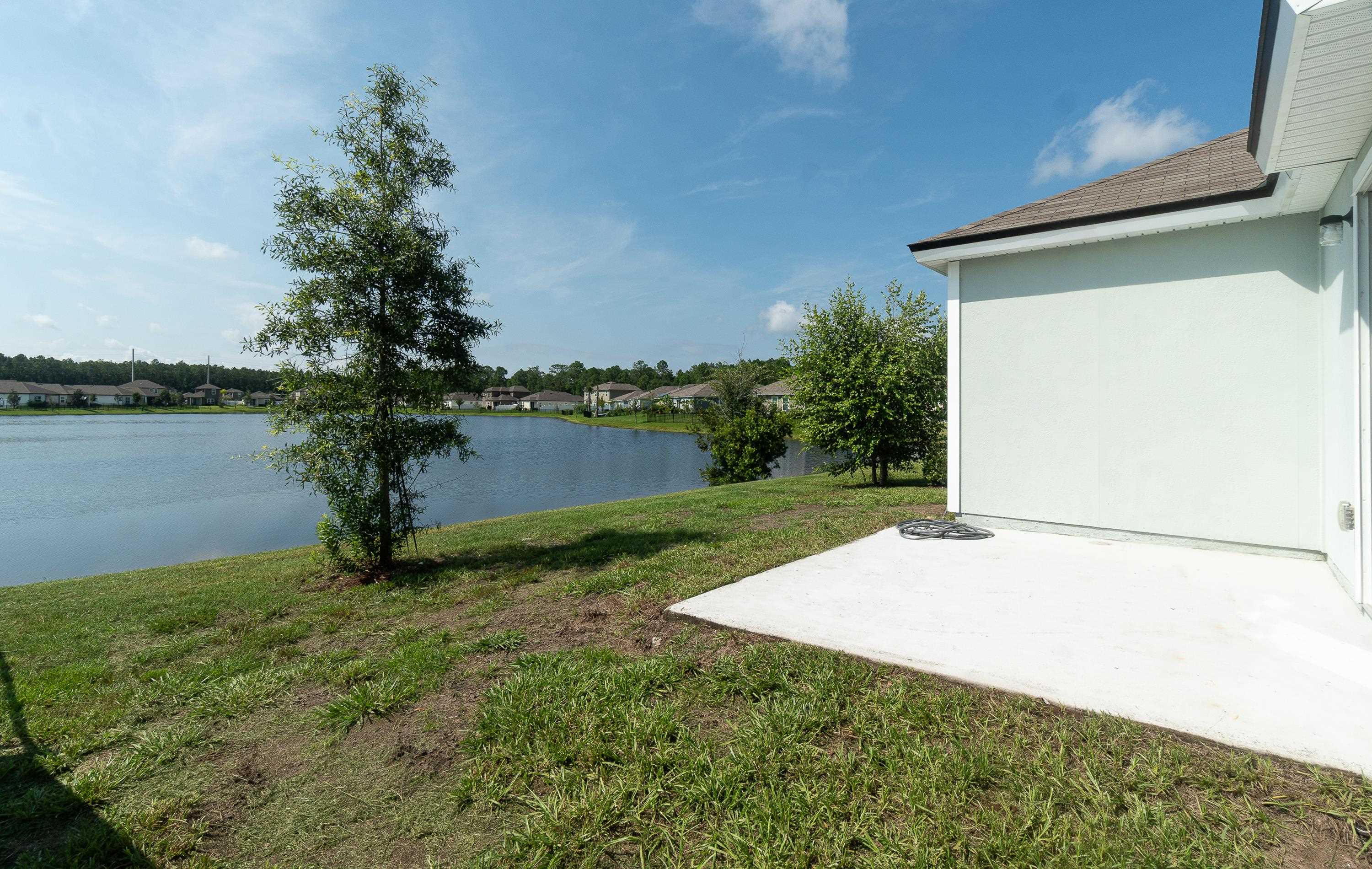 233 Falcon Ridge Road St. Augustine, FL 32084 - Photo 32 of 41 a view of a yard with a house