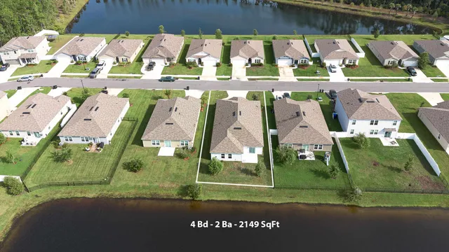 a view of a backyard with large trees