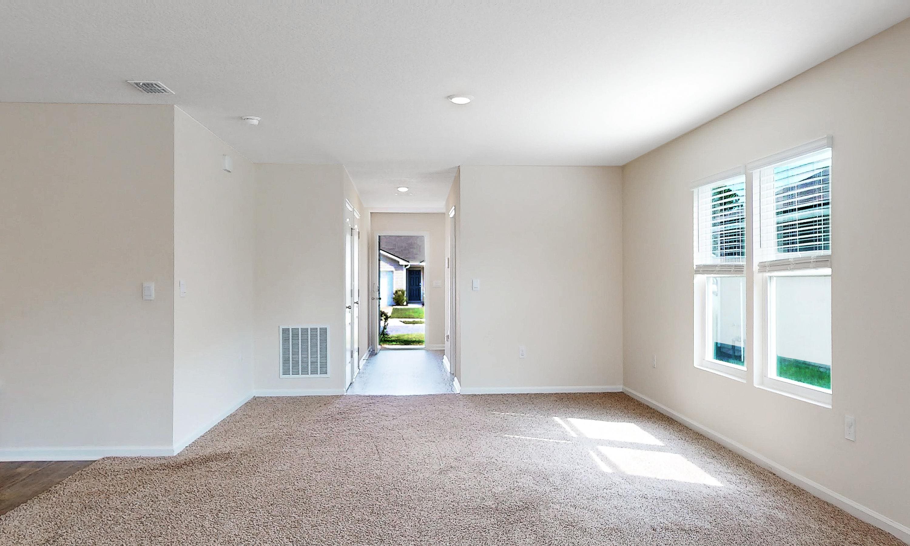 233 Falcon Ridge Road St. Augustine, FL 32084 - Photo 6 of 41 an empty room with windows and entrance