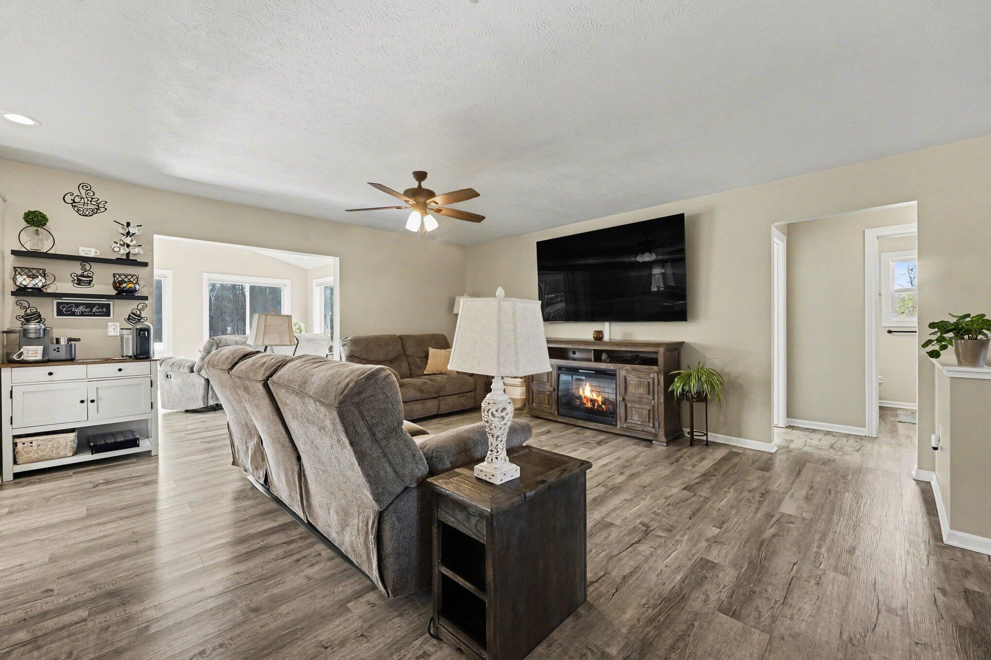 7450 19 Mile Road Northeast Cedar Springs, MI 49319 - Photo 6 of 34 Open to Sunroom and Kitchen!