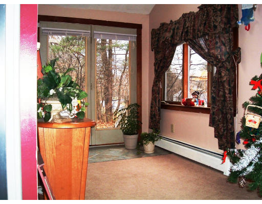 59 Middle Road Amesbury, MA 01913 - Photo 6 of 11 a view of a living room and a window