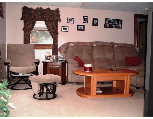 59 Middle Road Amesbury, MA 01913 - Photo 7 of 11 a living room with furniture and a window