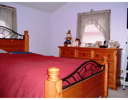 59 Middle Road Amesbury, MA 01913 - Photo 10 of 11 a bed room with a bed and a dresser